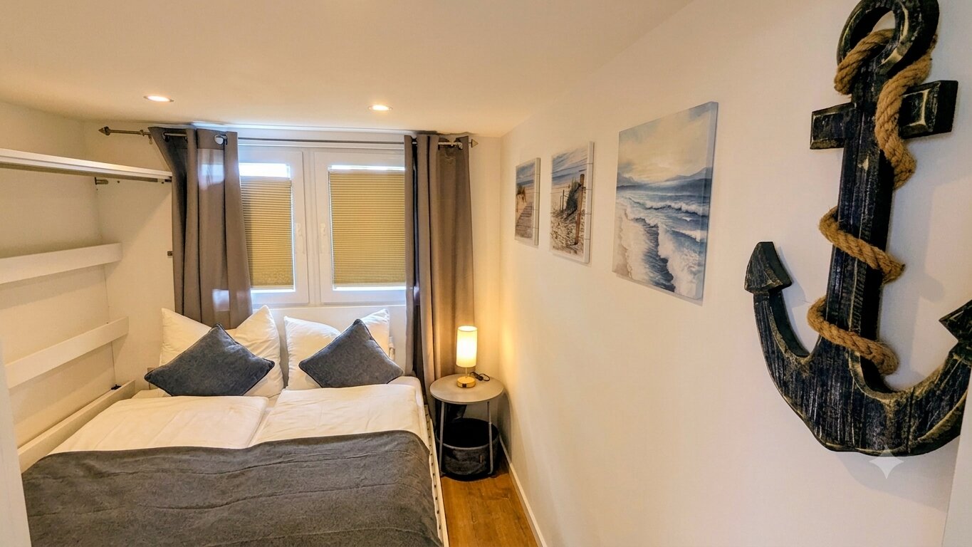 Schlafbereich mit Doppelbett im Tiny House Nachtigall